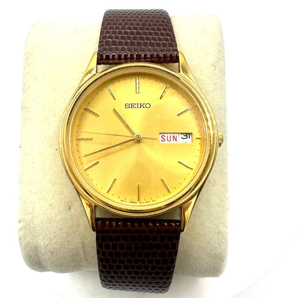 Seiko 7N43-8A99 Quartz Day Date gold round dial brown leather strap watch